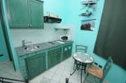 Green kitchenette one-room flat